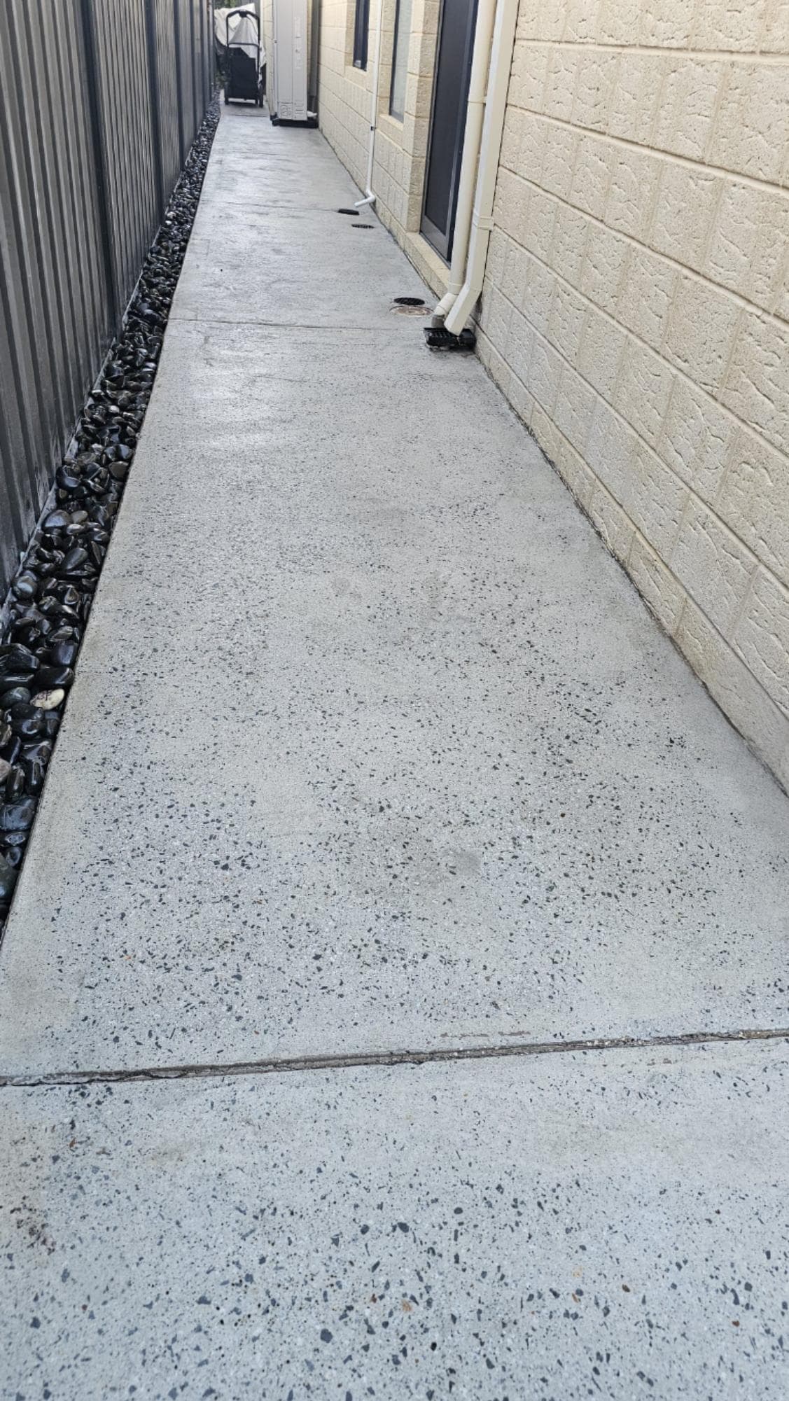 Garage concrete floor after paint removal and hone & seal finish