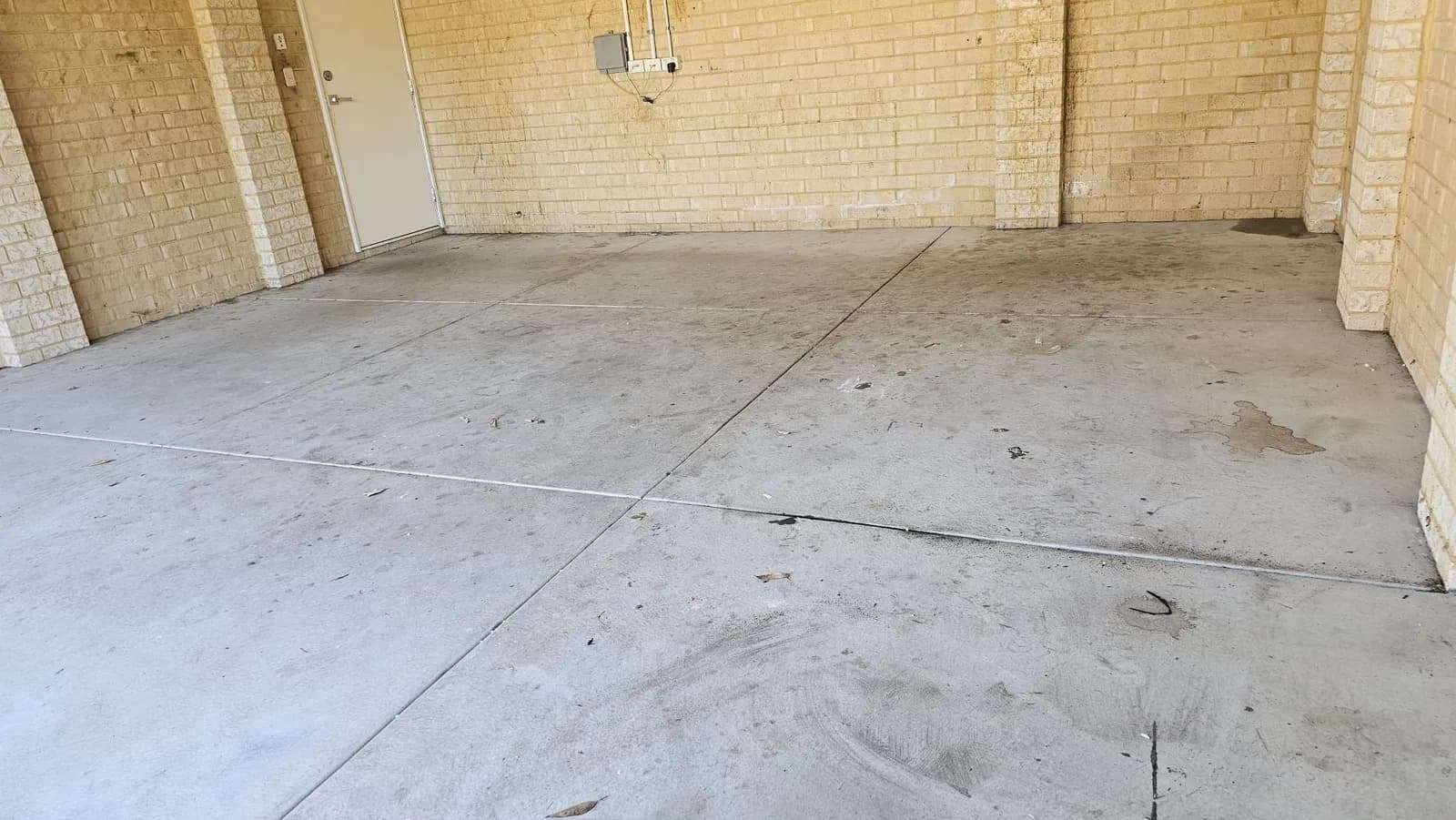 Perth garage concrete slab before diamond grinding, marked and contaminated